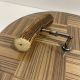 Vintage round wooden cheese board covered with glass plate with foldable handle