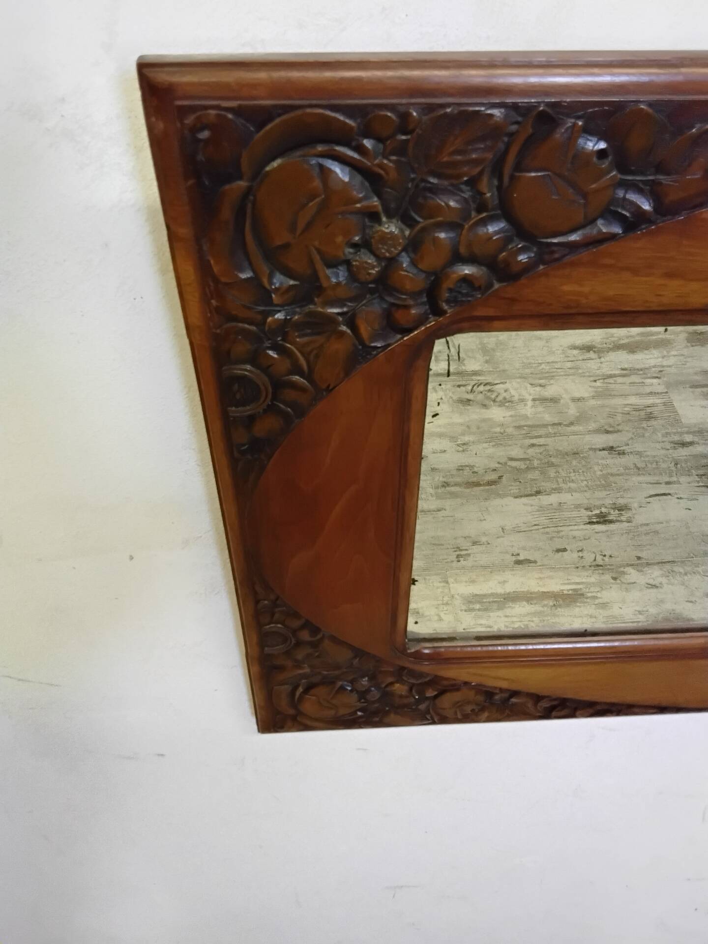 Art Deco mirror with a wooden frame