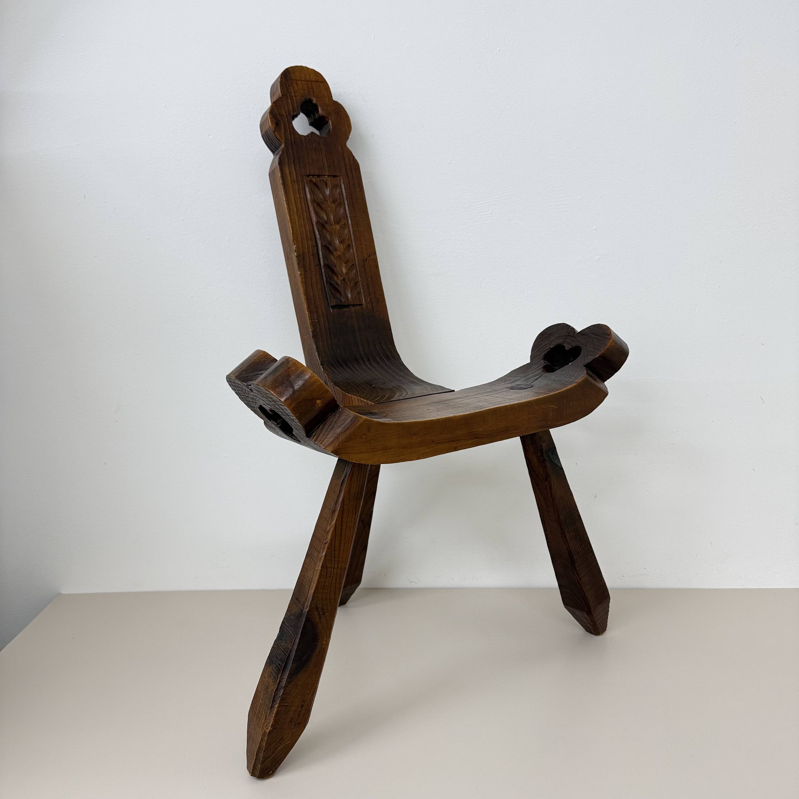 Brutalist hand carved oak Spanish tripod chair , 1970s