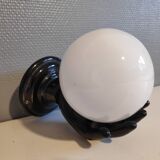 Black ceramic handand white opaline ball sconce