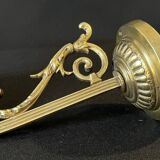 20th century Louis XVI style swan neck wall light in arabesque bronze and pleated glass tulip.