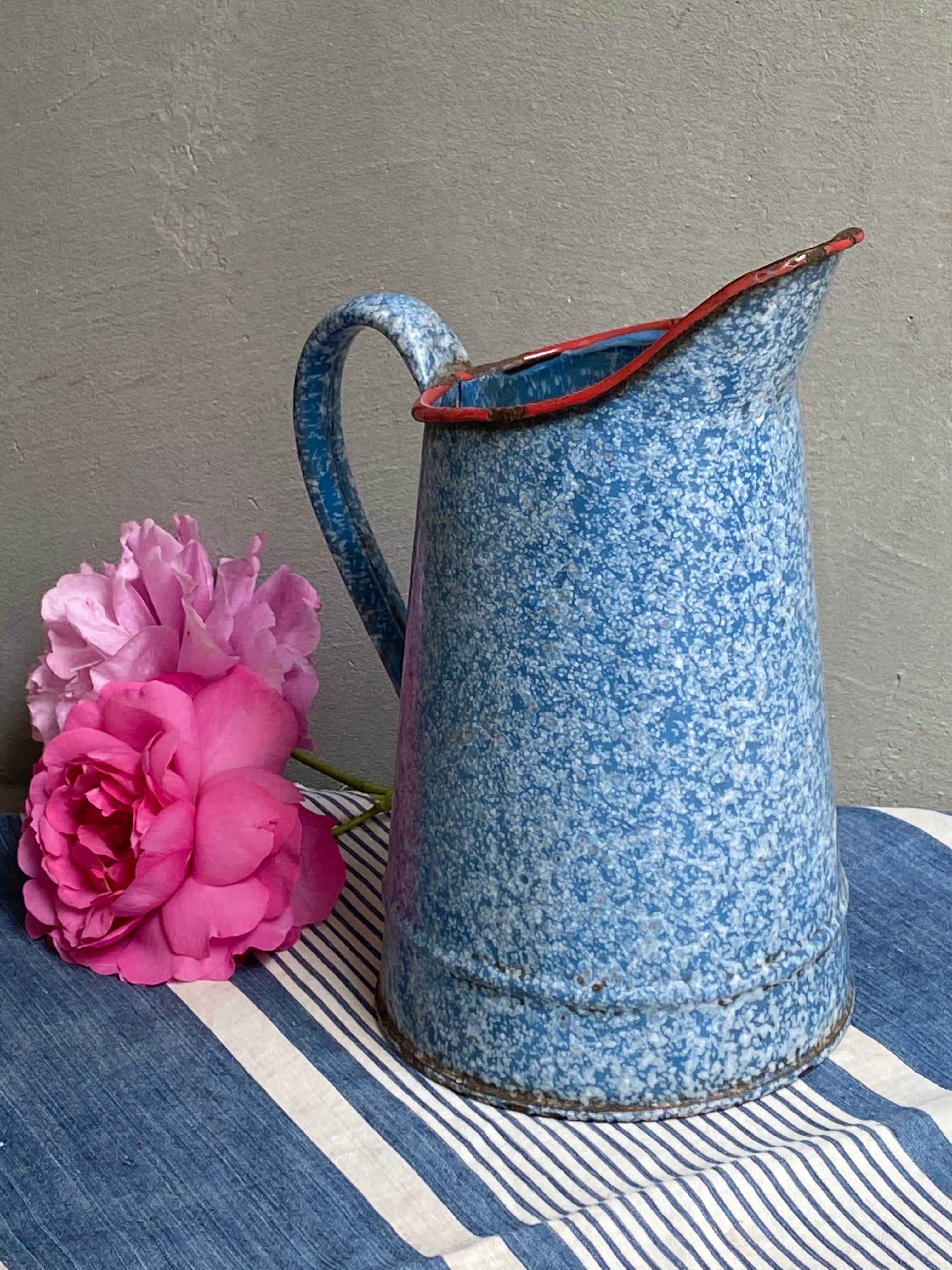 Old enamelled pitcher