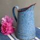 Old enamelled pitcher