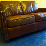 Patinated brown stitched leather 2 seater sofa with brass studs