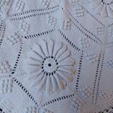White bed throw with relief embroidery and floral patterns