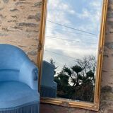 Grand miroir en bois sculpté doré