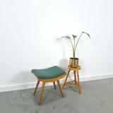 Vintage footrest stool with blue-green cushion