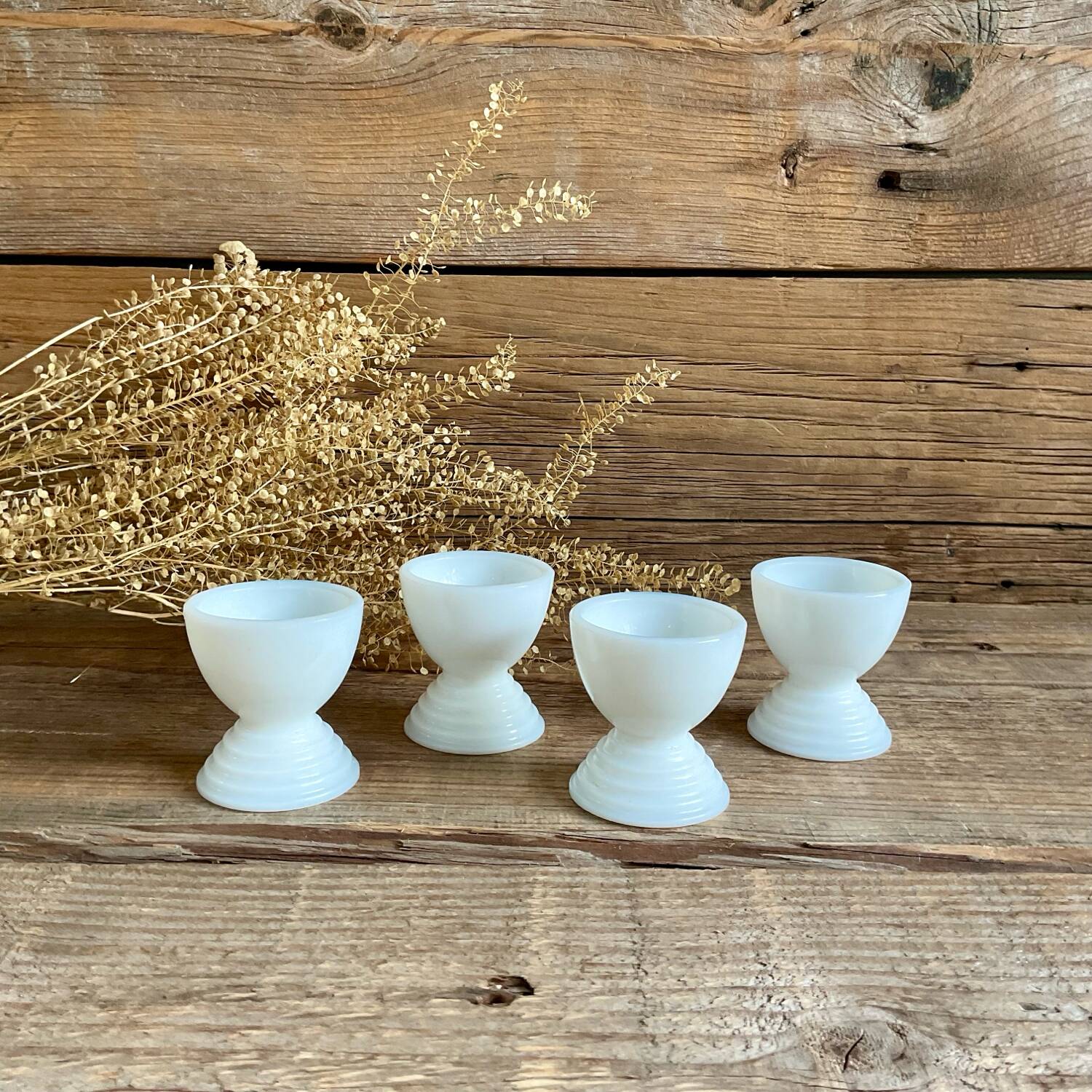 4 egg cups in white opaline glass