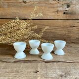 4 egg cups in white opaline glass