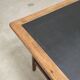 Vintage workshop folding table in oak with a hand-patinated black top.