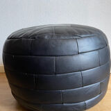 Black patchwork leather pouf from Sède
