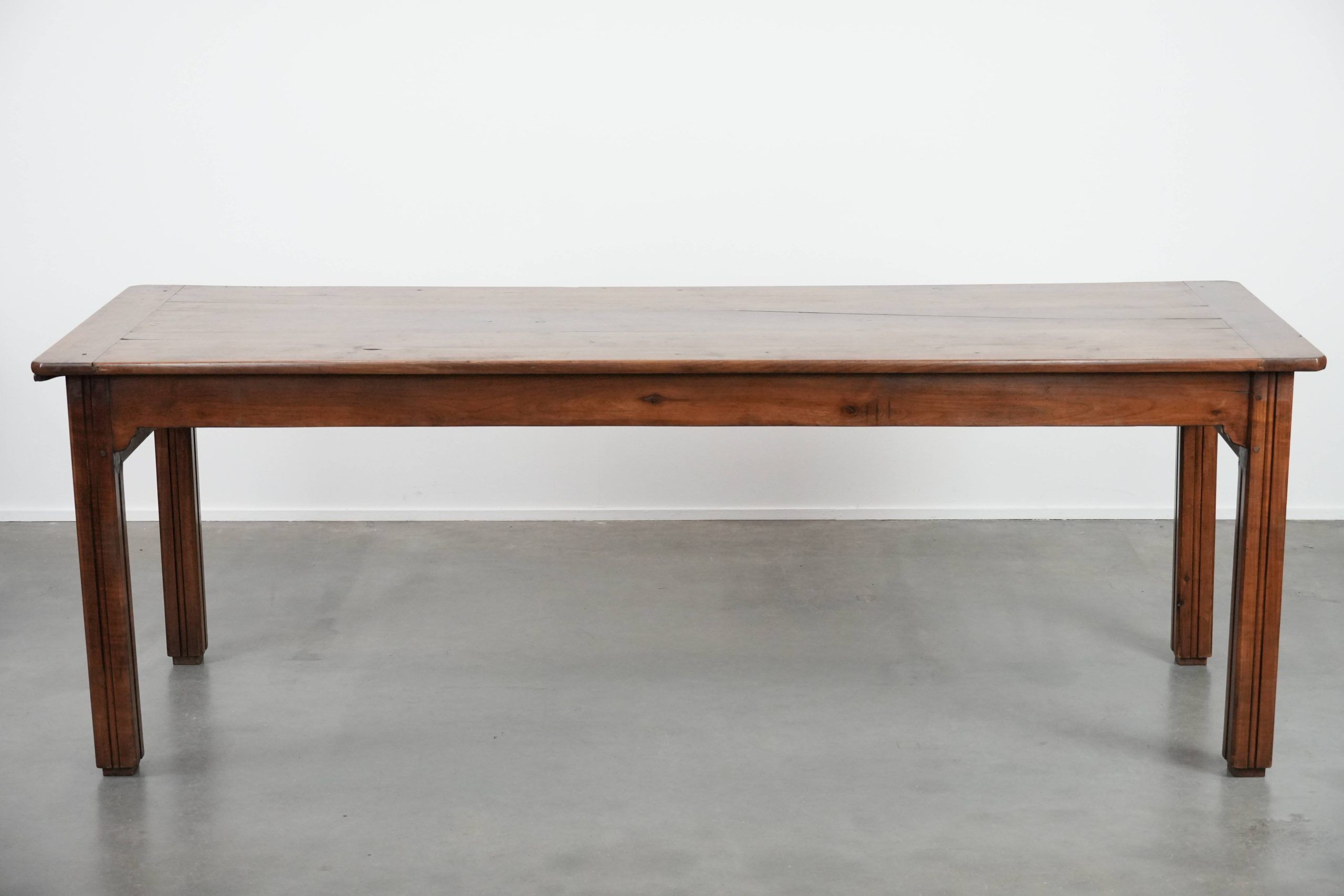 Antique French farmhouse dining table with two drawers and a pull-out board