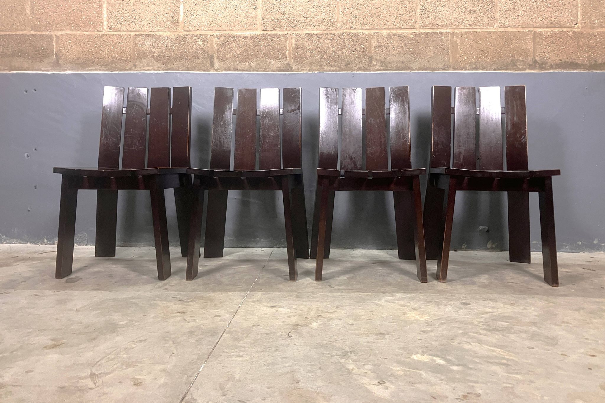 Brutalist and modernist dining chairs from the 1970s in architectural brown wood.