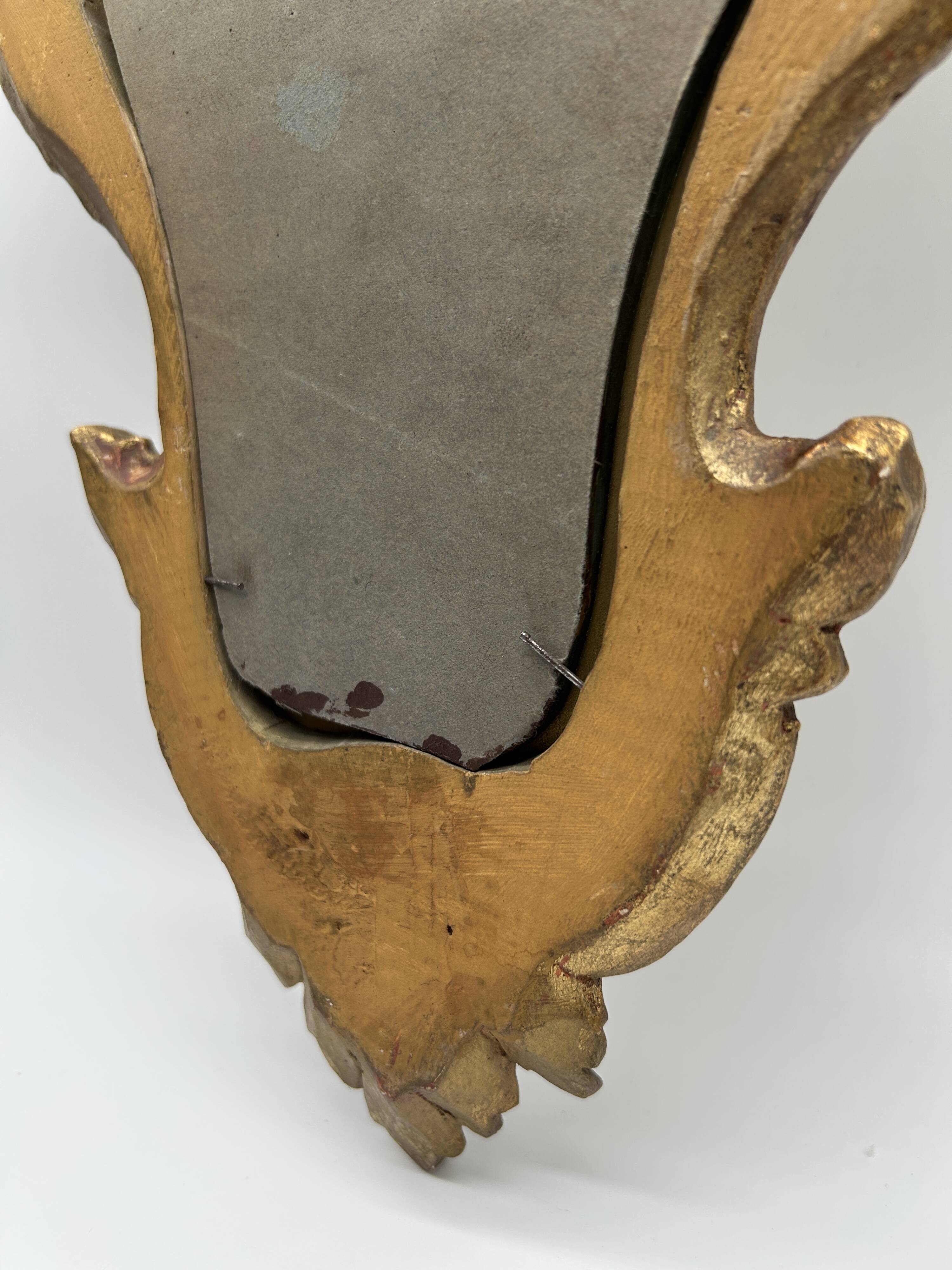 Wooden mirror with gilded stucco