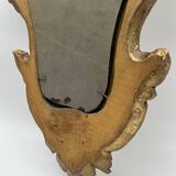 Wooden mirror with gilded stucco