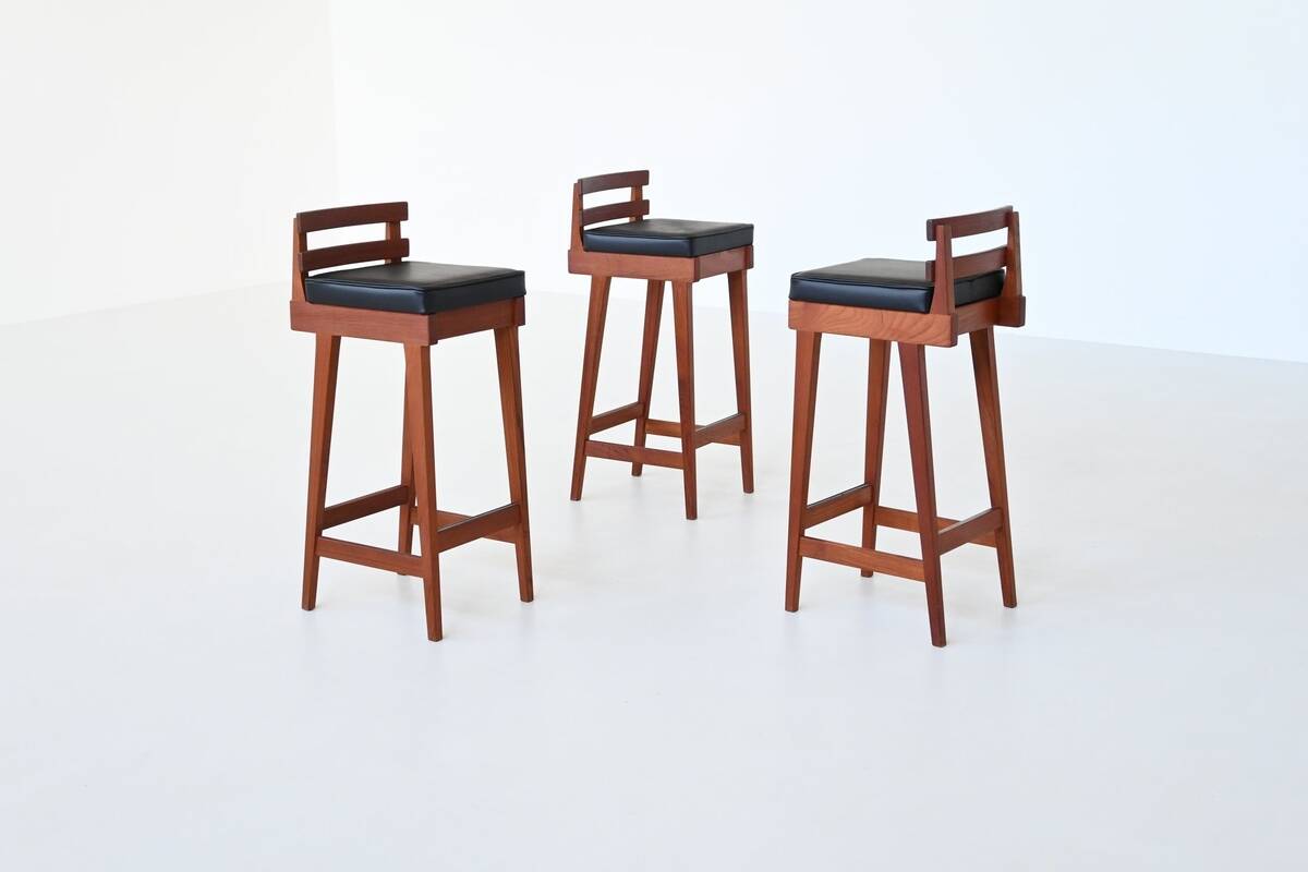 Erik Buck set of three bar stools in teak and leather Dyrlund Denmark 1960