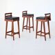Erik Buck set of three bar stools in teak and leather Dyrlund Denmark 1960