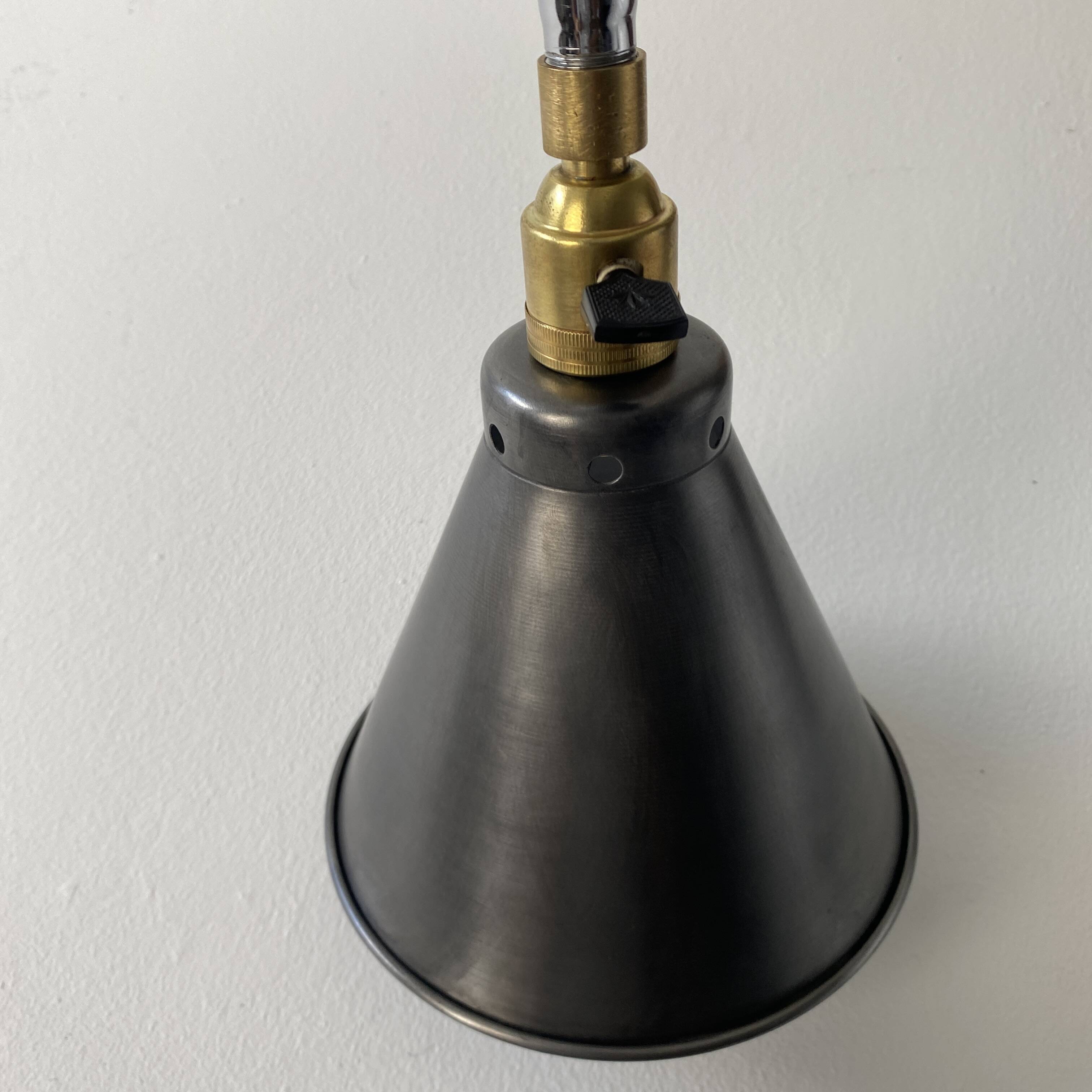 Old industrial wall light that is vintage.