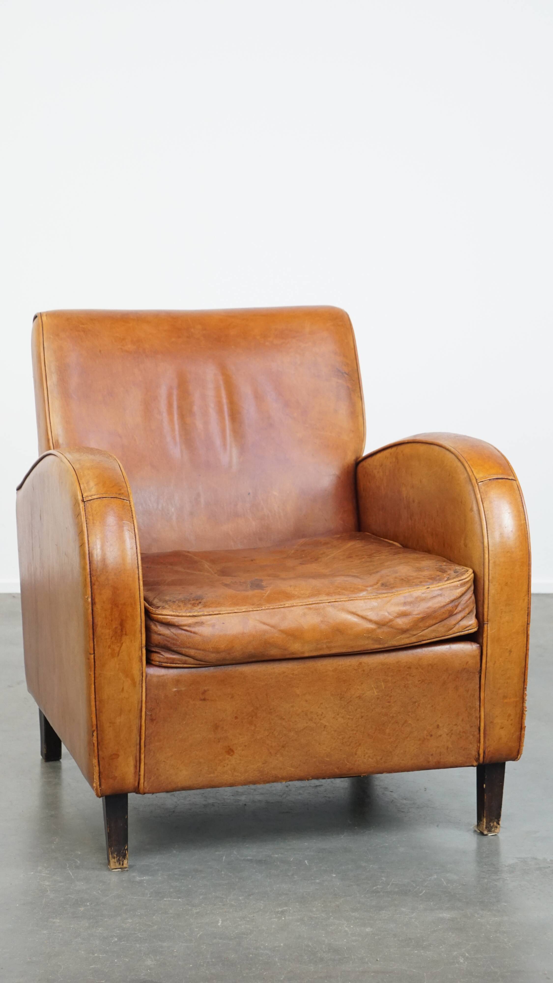 Characteristic sheepskin design armchair in beautiful warm cognac colours