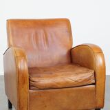 Characteristic sheepskin design armchair in beautiful warm cognac colours