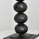 three designer candle holders in matte black metal
