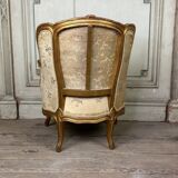 A Louis XV style child's bergère chair in carved and gilded wood, circa 1880