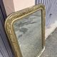 Large Louis Philippe mirror in carved gilded wood with mercury glass.