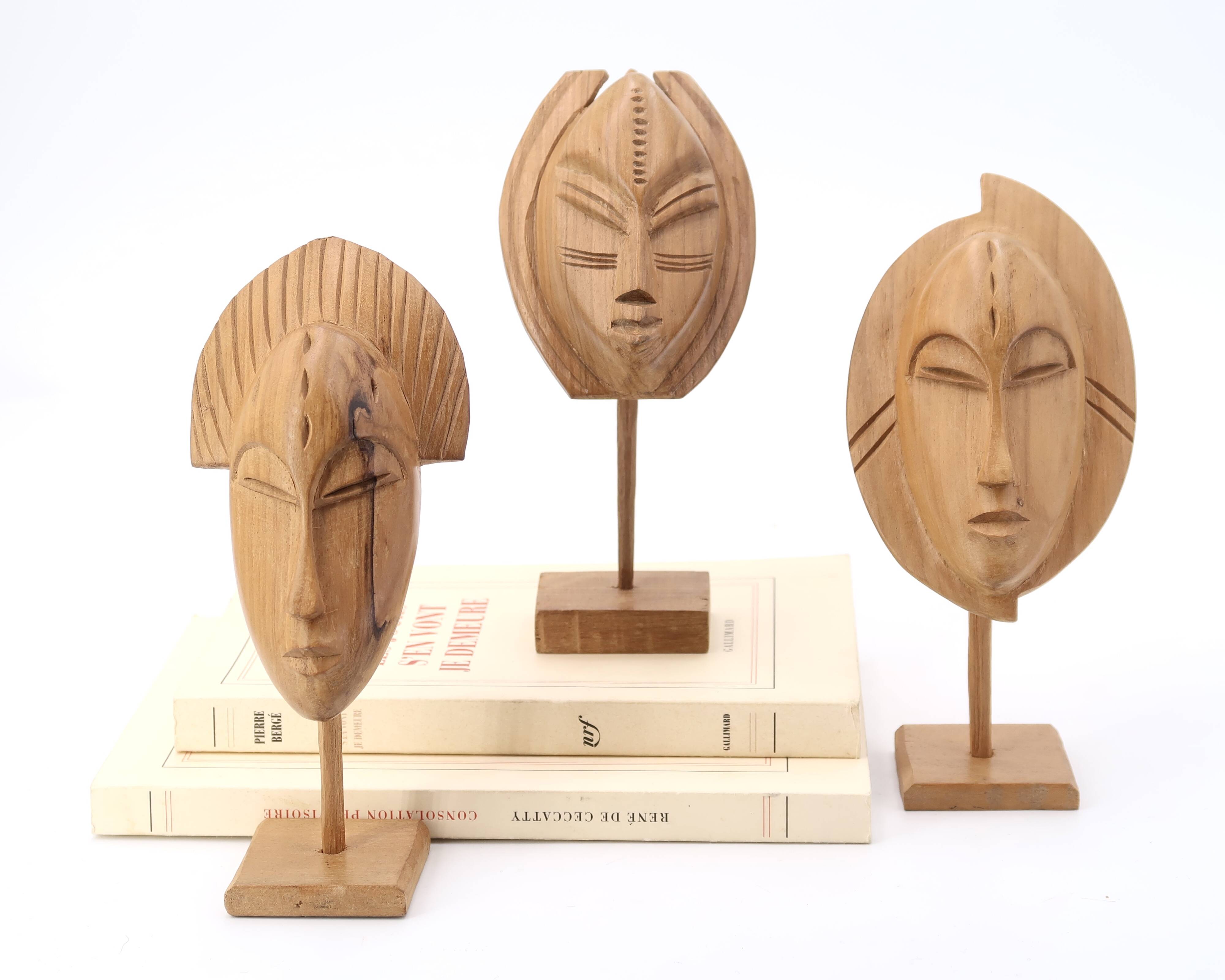Six African masks with wooden bases, 1970s
