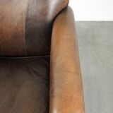 Armchair / lounge chair made of sheepskin leather with characterful patina