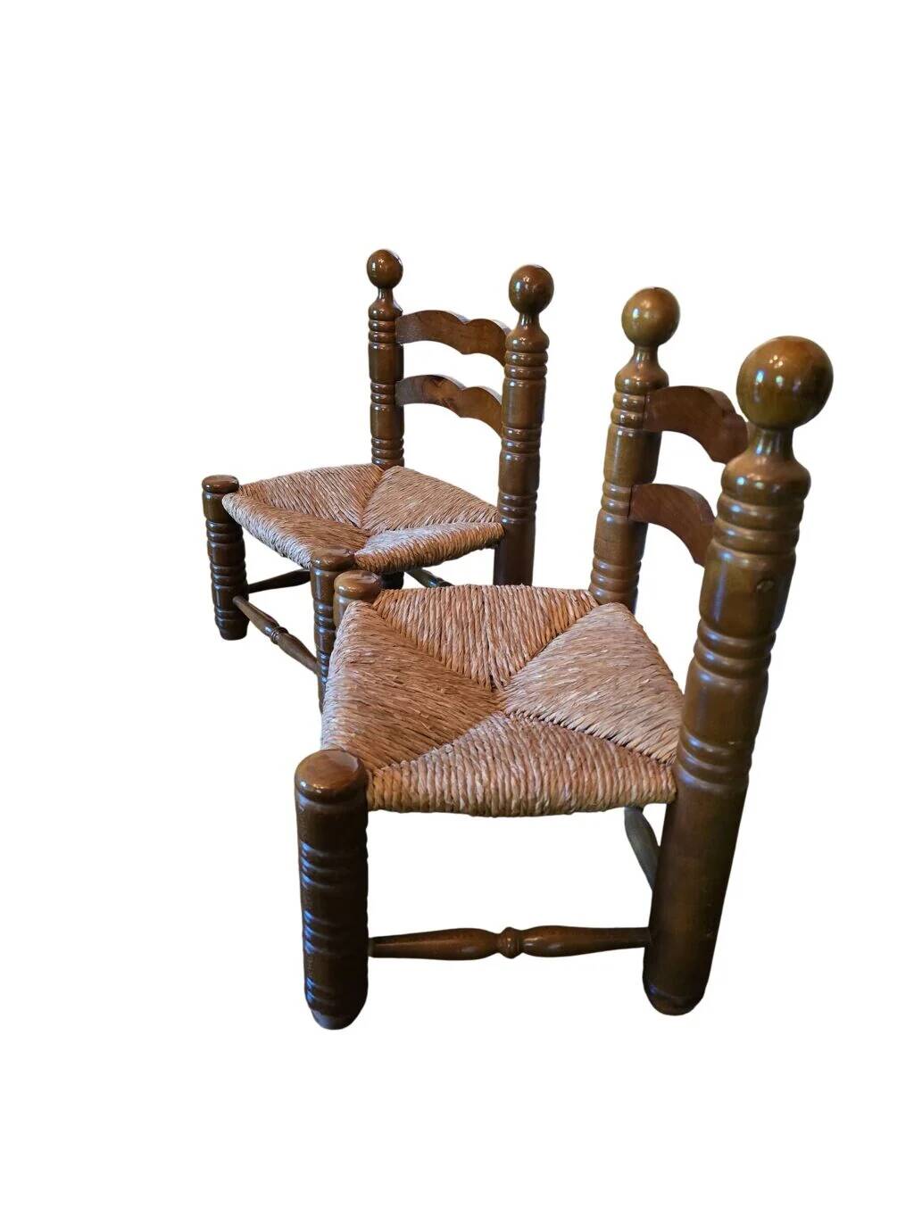 Pair of low fireplace chairs in turned wood and straw, Charles style.