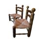 Pair of low fireplace chairs in turned wood and straw, Charles style.