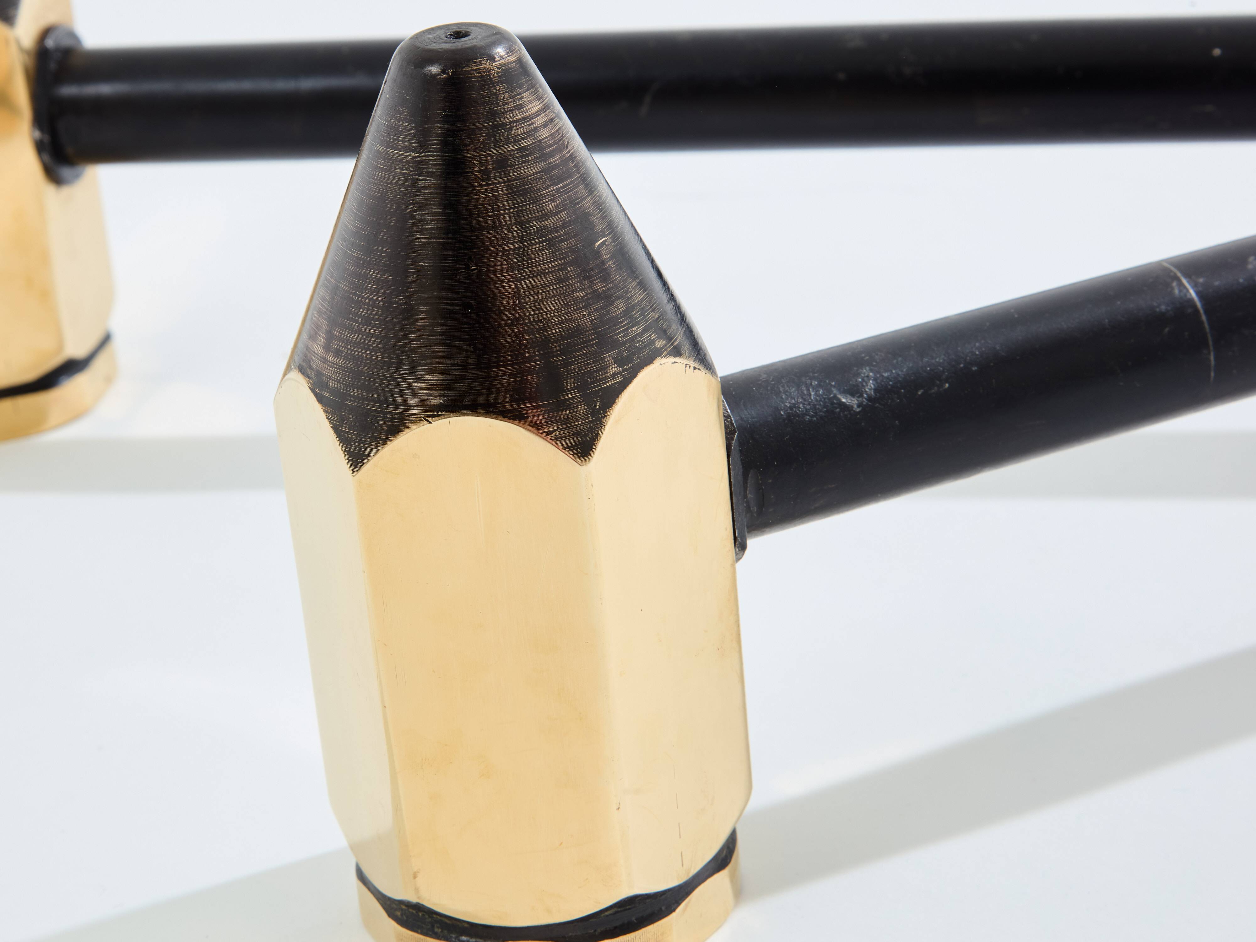 Pair of pencil andirons in brass and wrought iron circa 1960