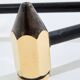 Paire de chenets crayons en laiton et fer forgé vers 1960
