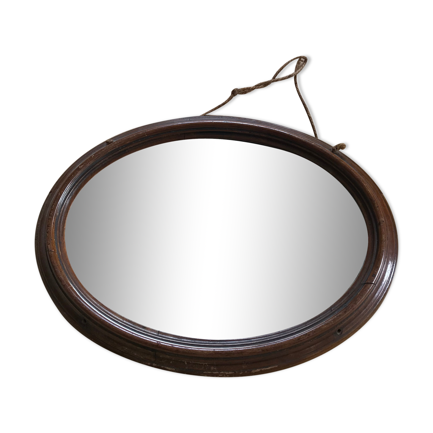 Old oval mirror with wooden frame