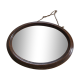 Old oval mirror with wooden frame