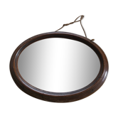 Old oval mirror with wooden frame