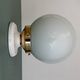 Vintage globe wall or ceiling light in white opaline.