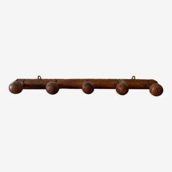 Old wooden wall coat rack