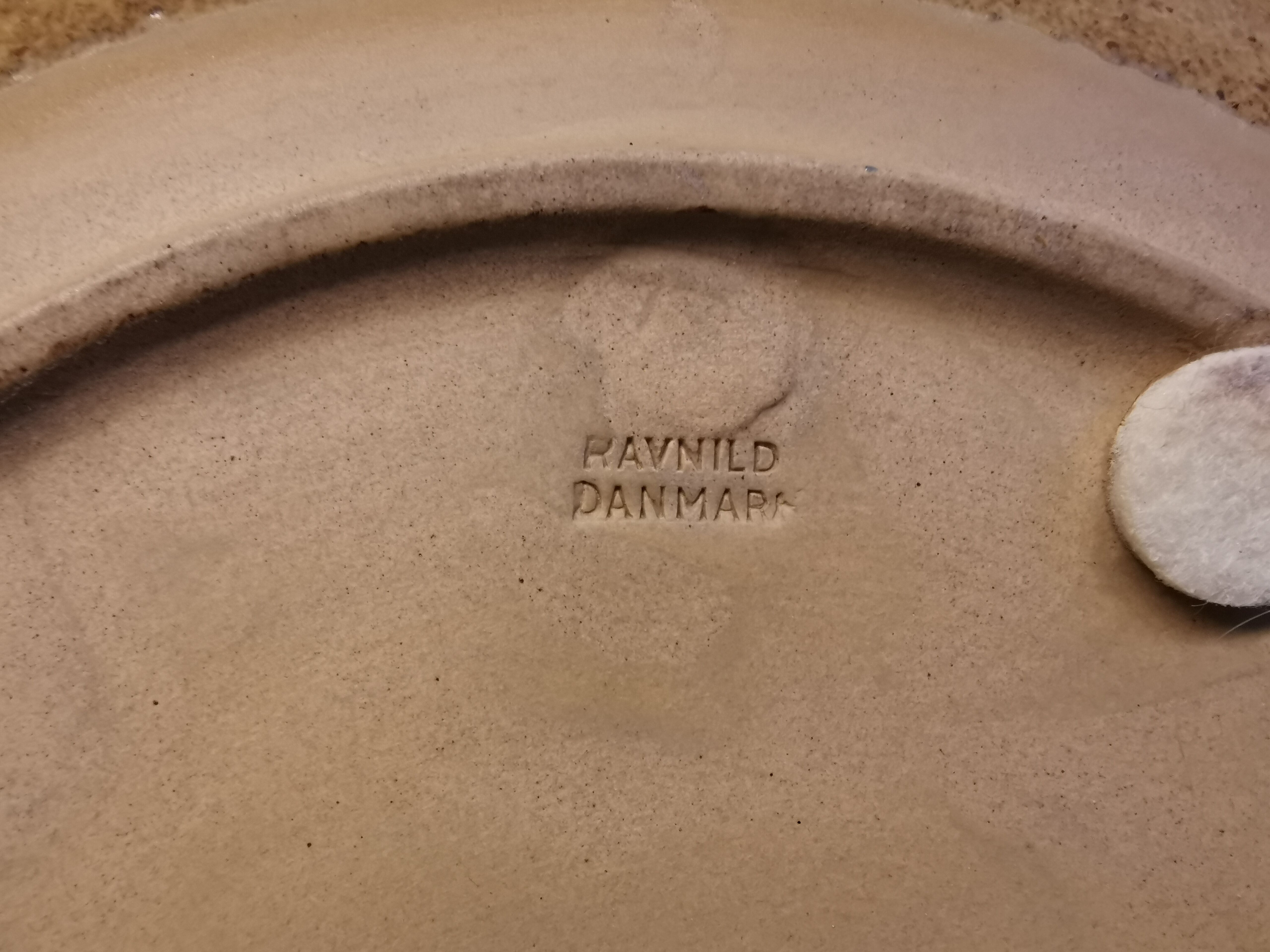 Ceramic plates, designed and made by Danish Ravnild (both stamped and signed)