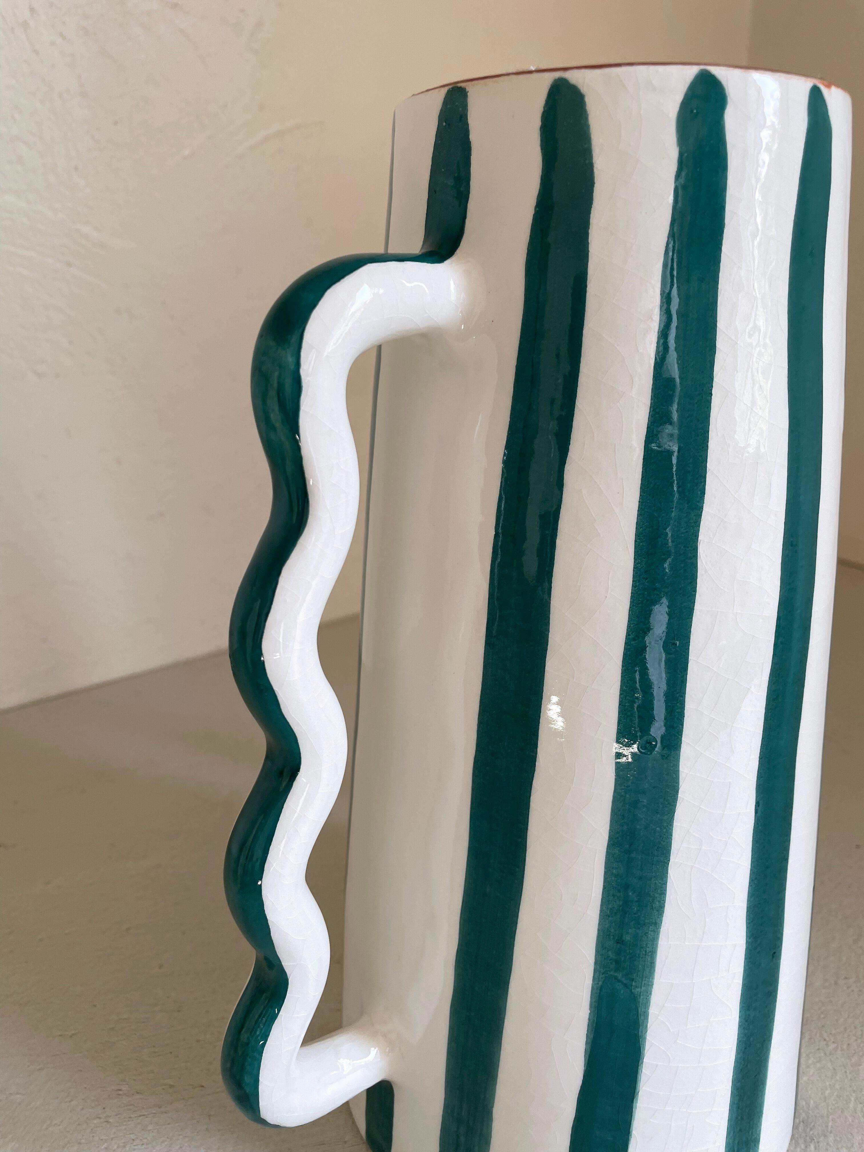 Fir and white green striped ceramic vase with handmade abstract wavy handles