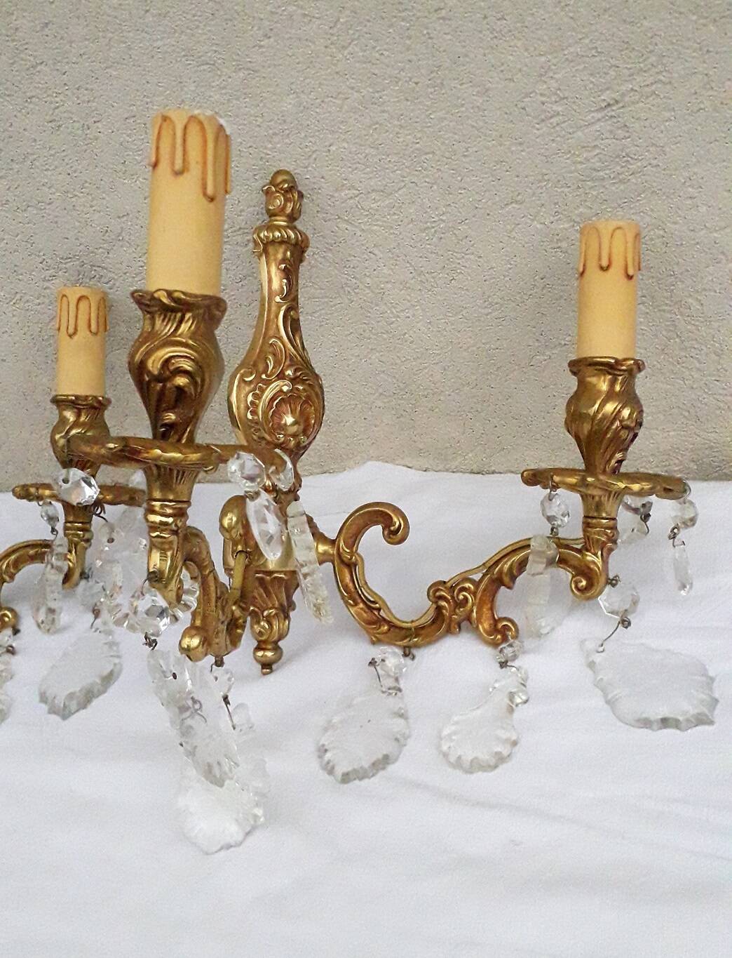pair of bronze wall lights with pendants