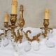 pair of bronze wall lights with pendants