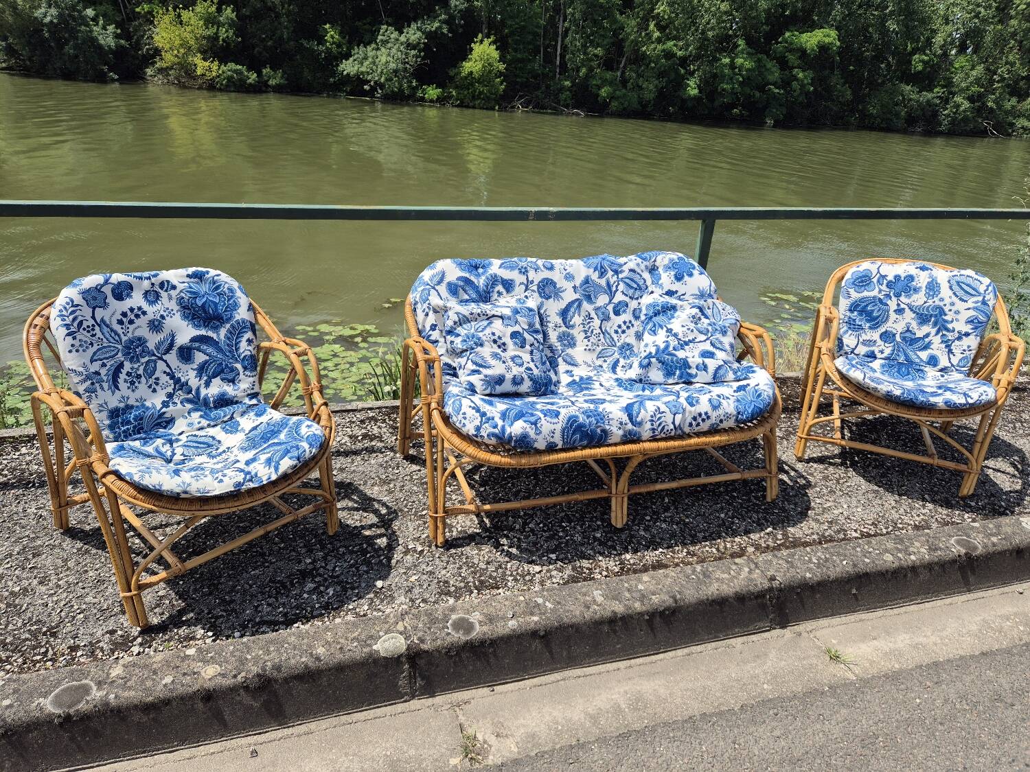 Rattan lounge with two armchairs and a vintage 1950s bench.