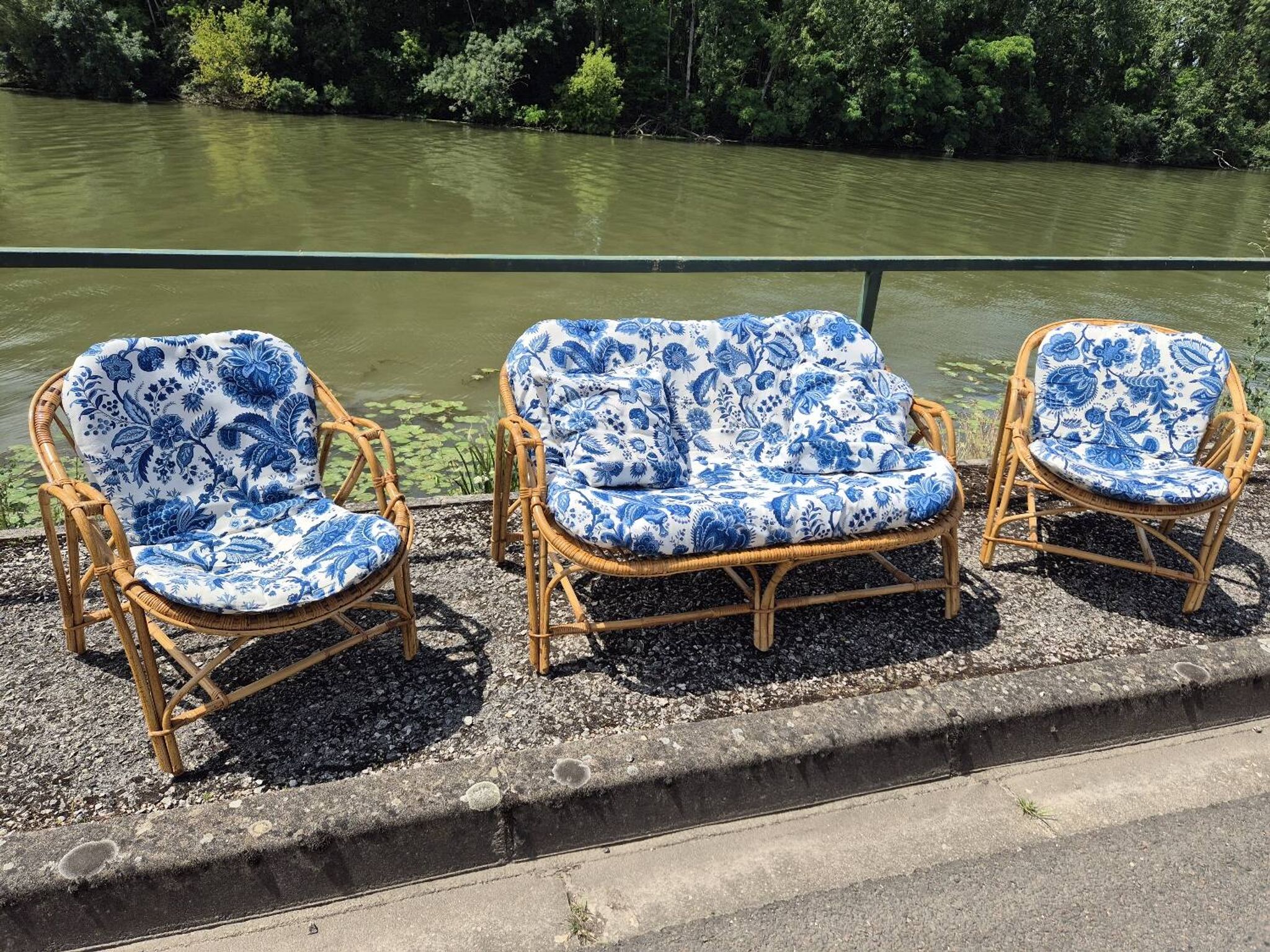 Rattan lounge with two armchairs and a vintage 1950s bench.