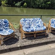 Rattan lounge with two armchairs and a vintage 1950s bench.