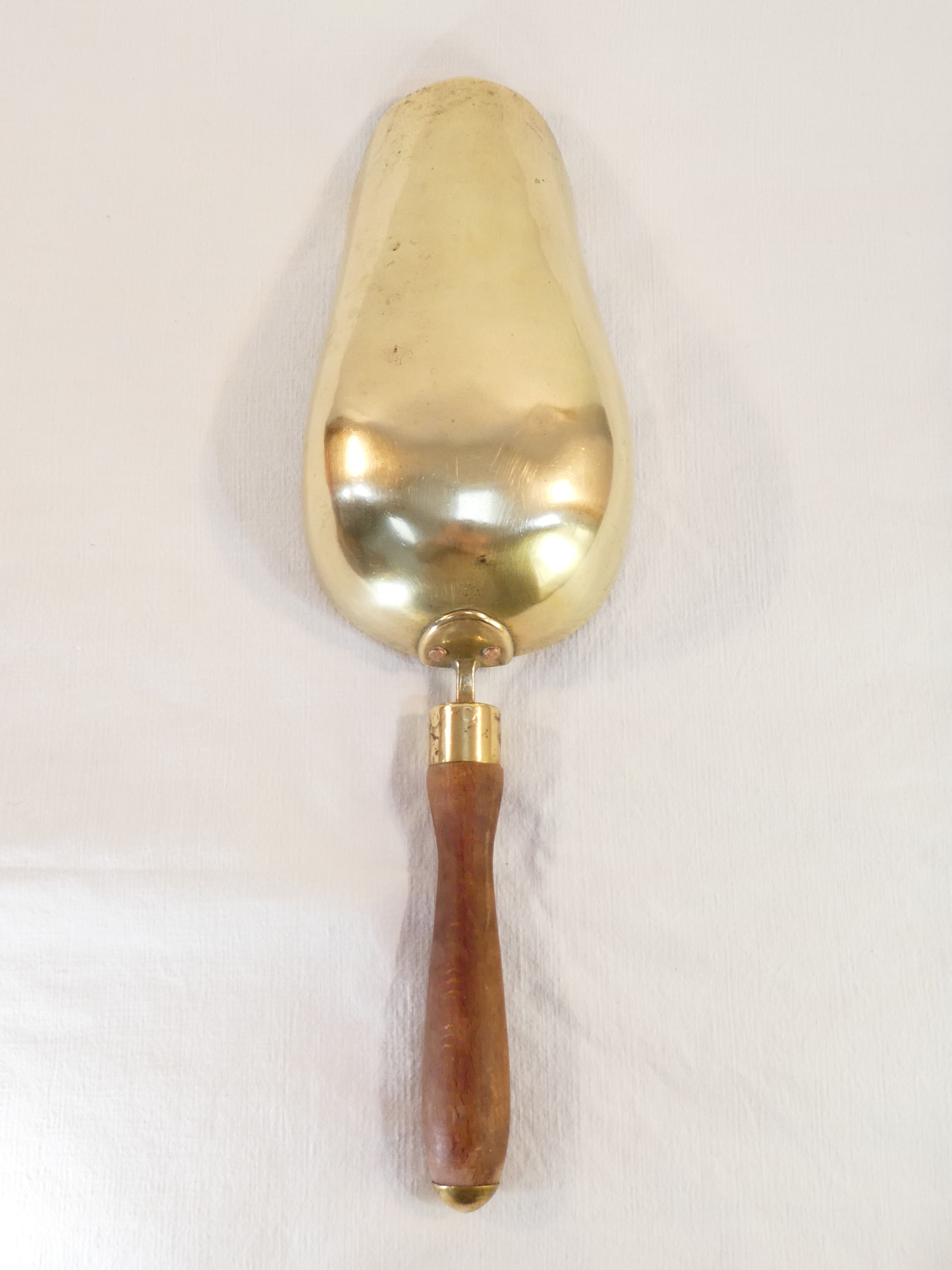 Old brass grocery grain shovel wooden handle