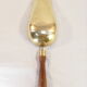 Old brass grocery grain shovel wooden handle