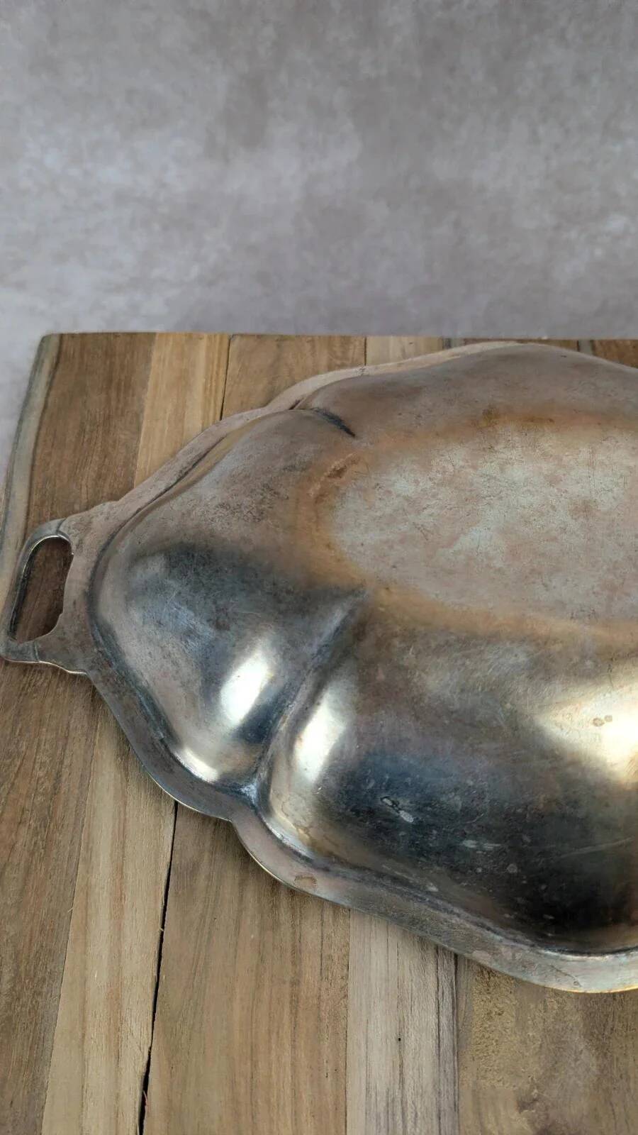 Antique oval silver-plated copper tray with handles.