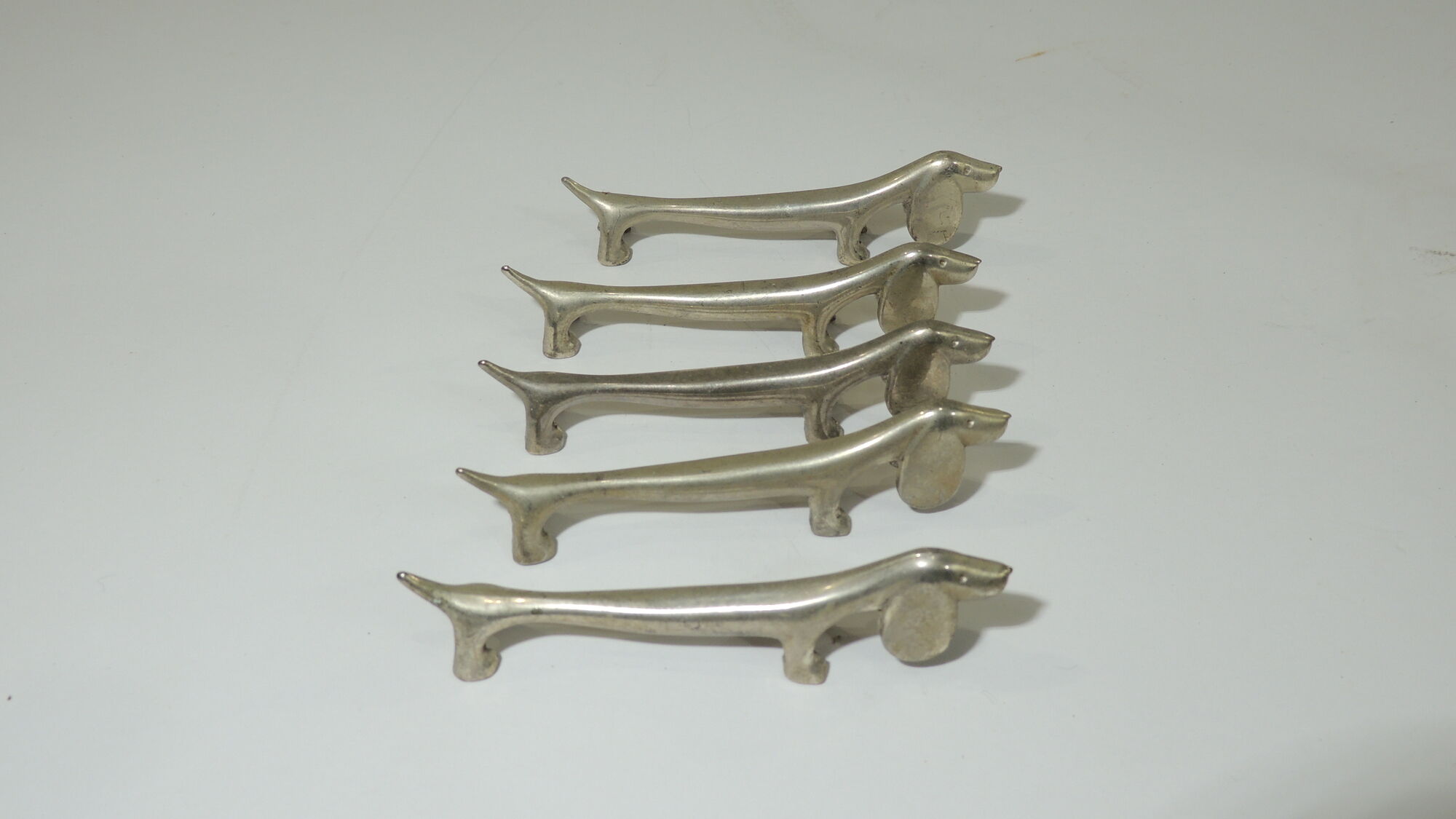 Lot 17 porte couteaux métal /chien /cheveaux/vintage