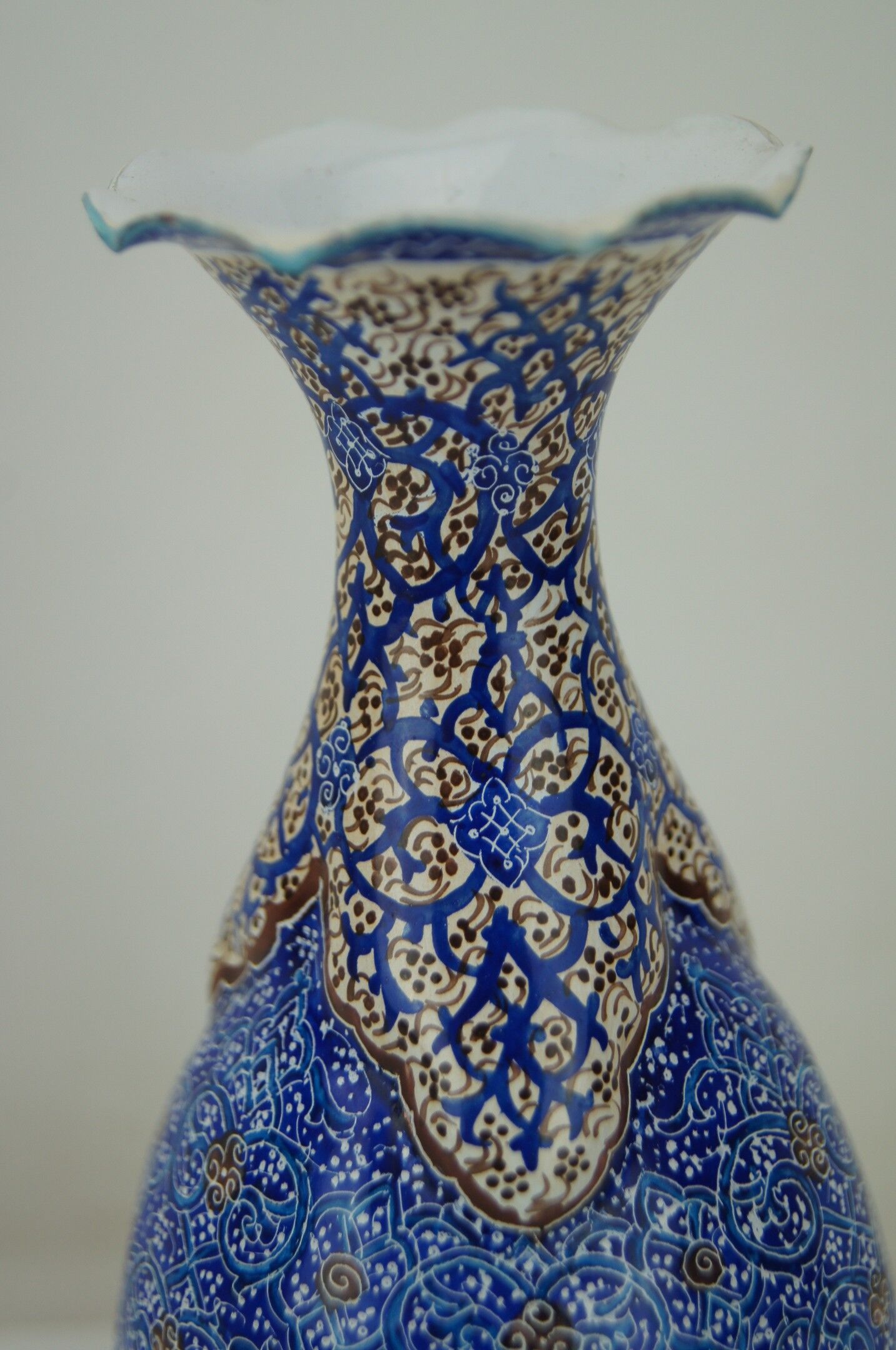 Piriform vase with a flared metal collar enamelled with a polychrome decoration, marked "Amini Iran" on the reverse.